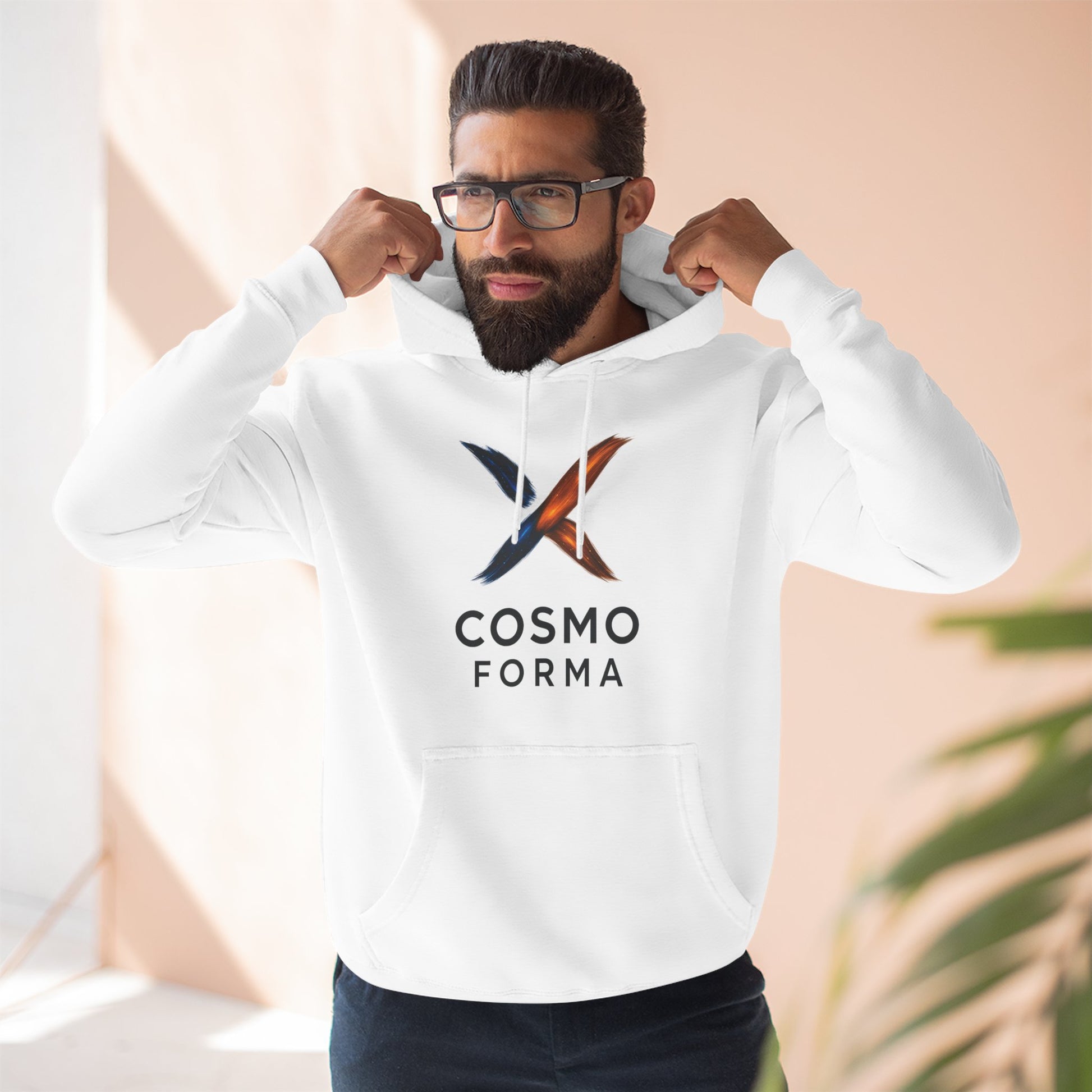 Man wearing a white hoodie with 'Cosmo Forma' logo flexing his muscles against a neutral background