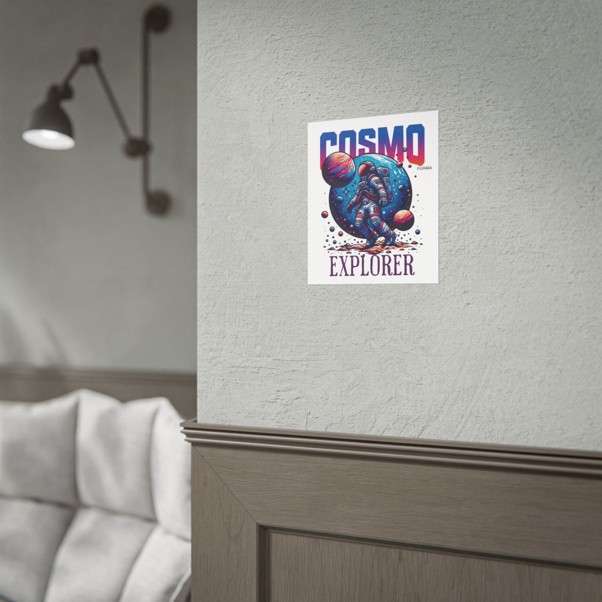 Poster with 'Cosmo Explorer' design on a wall next to a lamp and sofa.