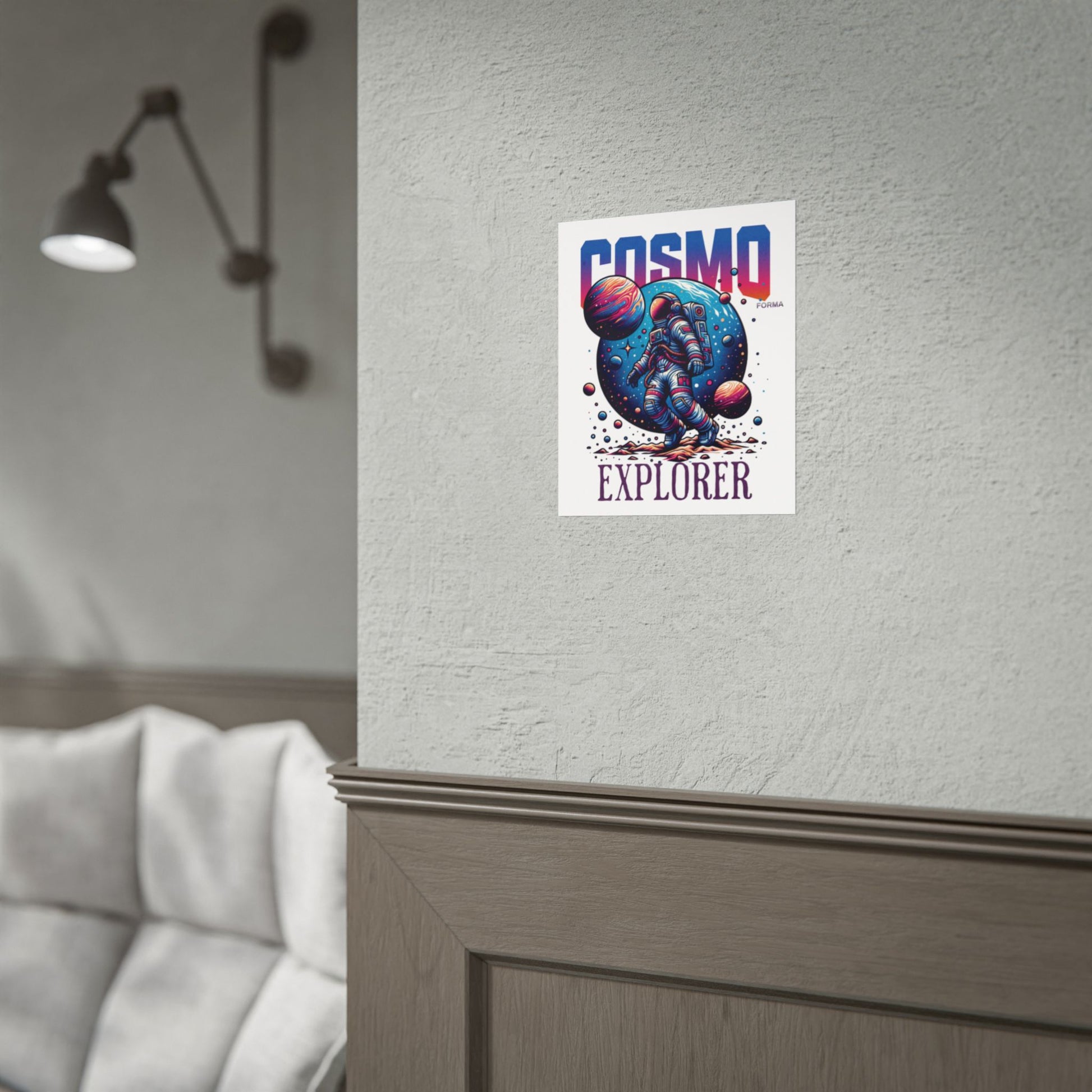 Poster with 'Cosmo Explorer' design on a wall next to a lamp and sofa.