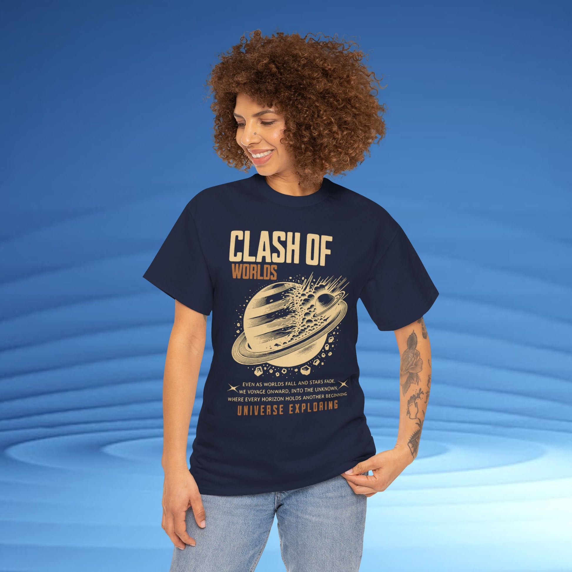 Person wearing a navy blue t-shirt with 'Clash of Worlds' graphic design on a blue background