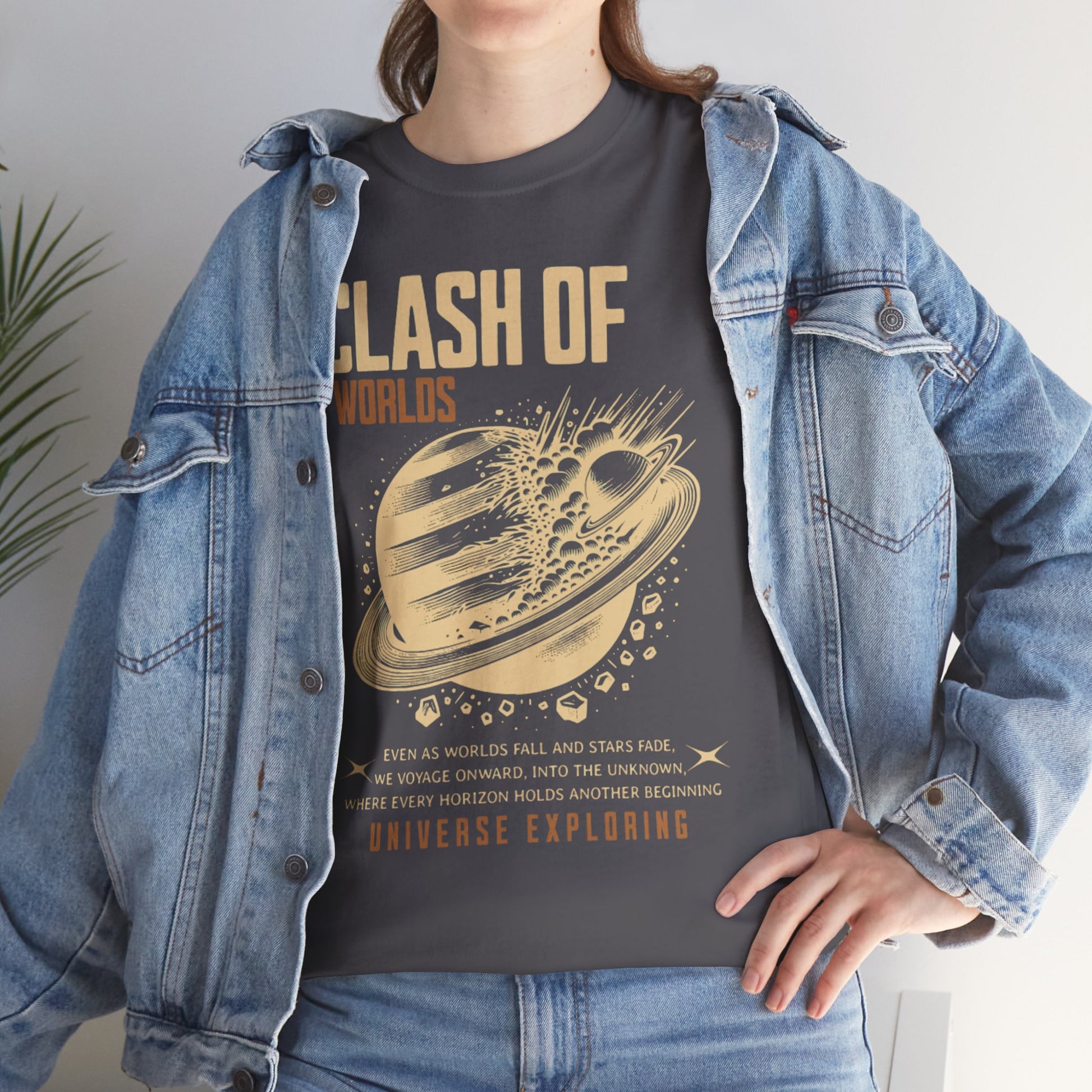 Person wearing a t-shirt with 'Clash of Worlds' design and denim jacket.