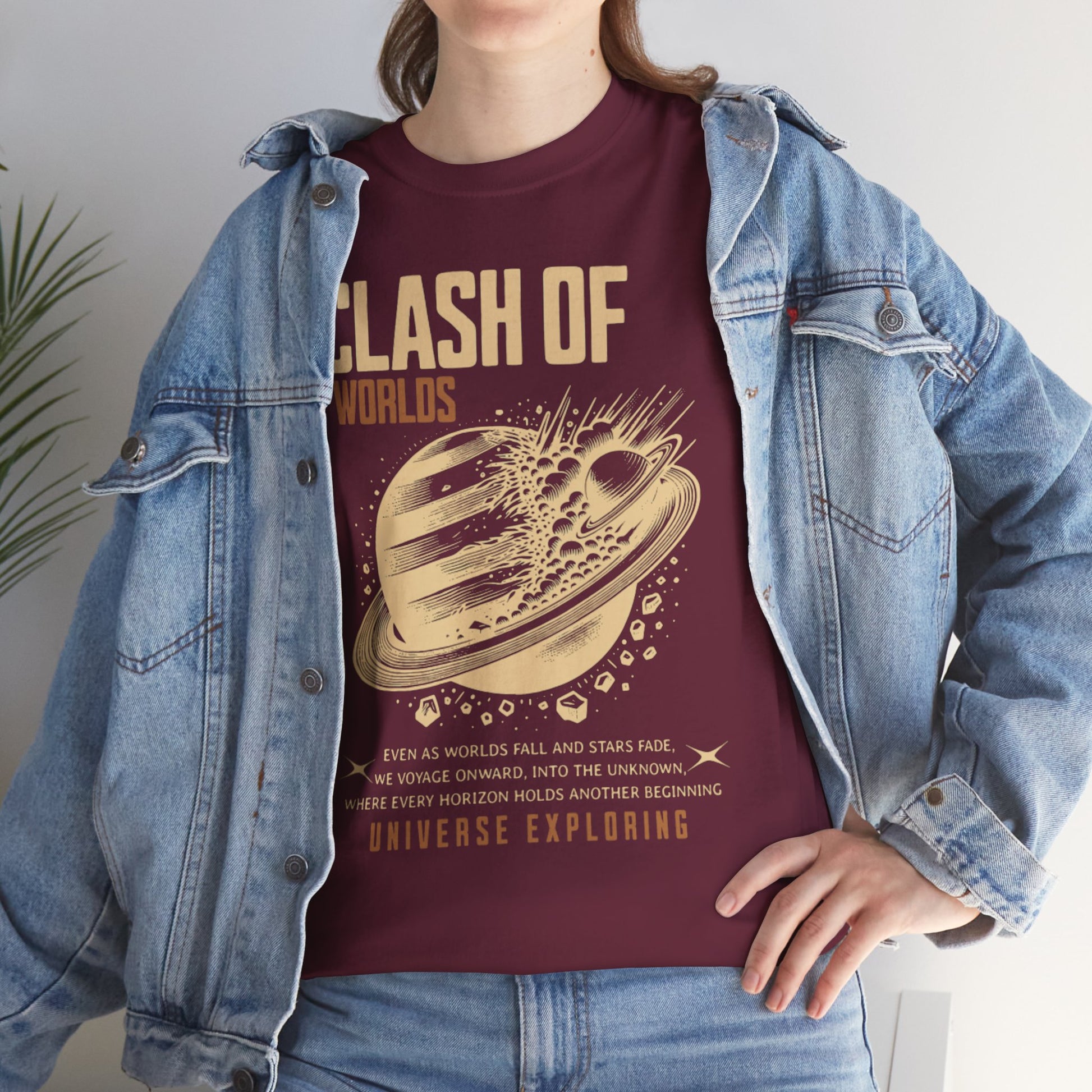 Person wearing a t-shirt with 'Clash of Worlds' design and denim jacket.