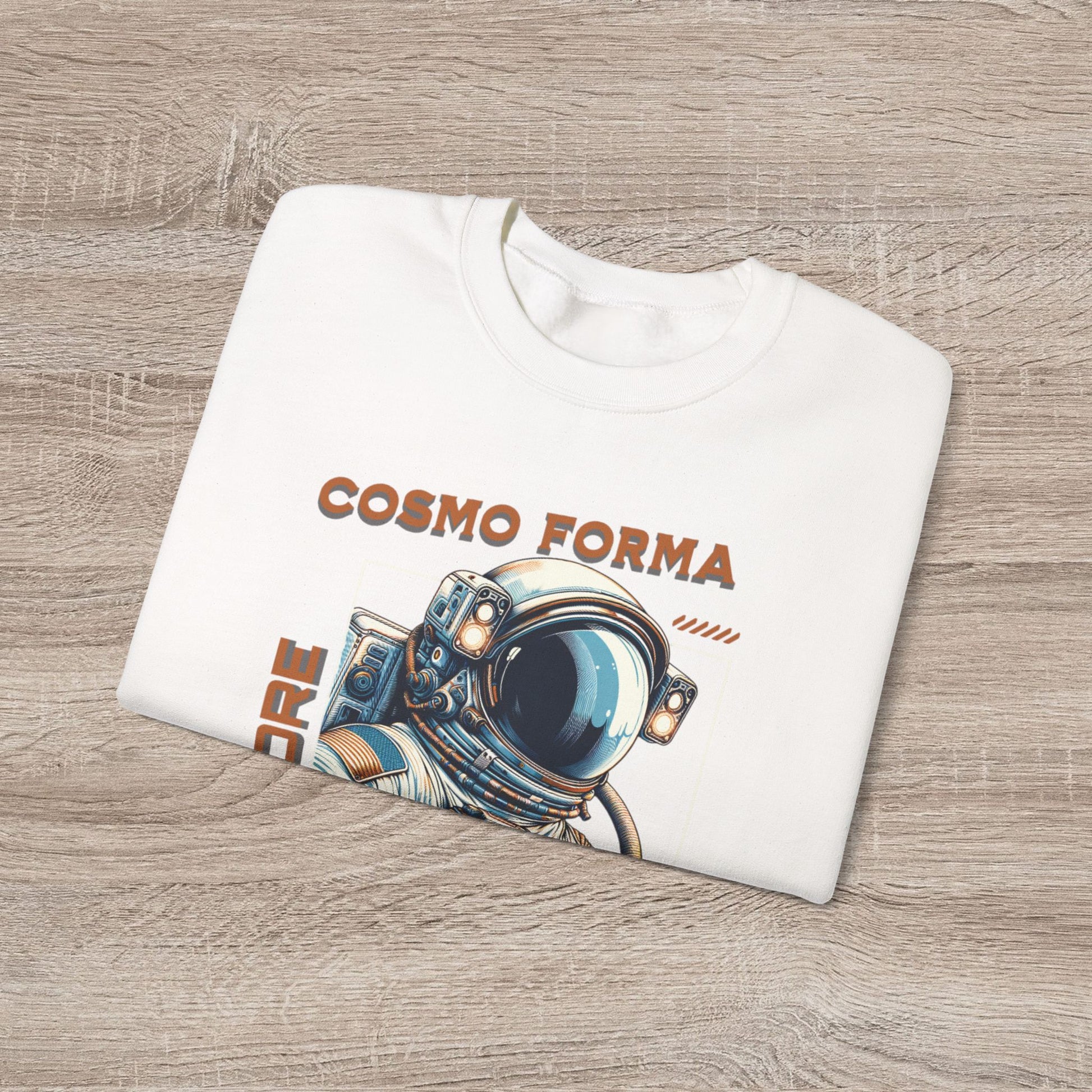 White sweatshirt with 'Cosmo Forma' design on a wooden surface
