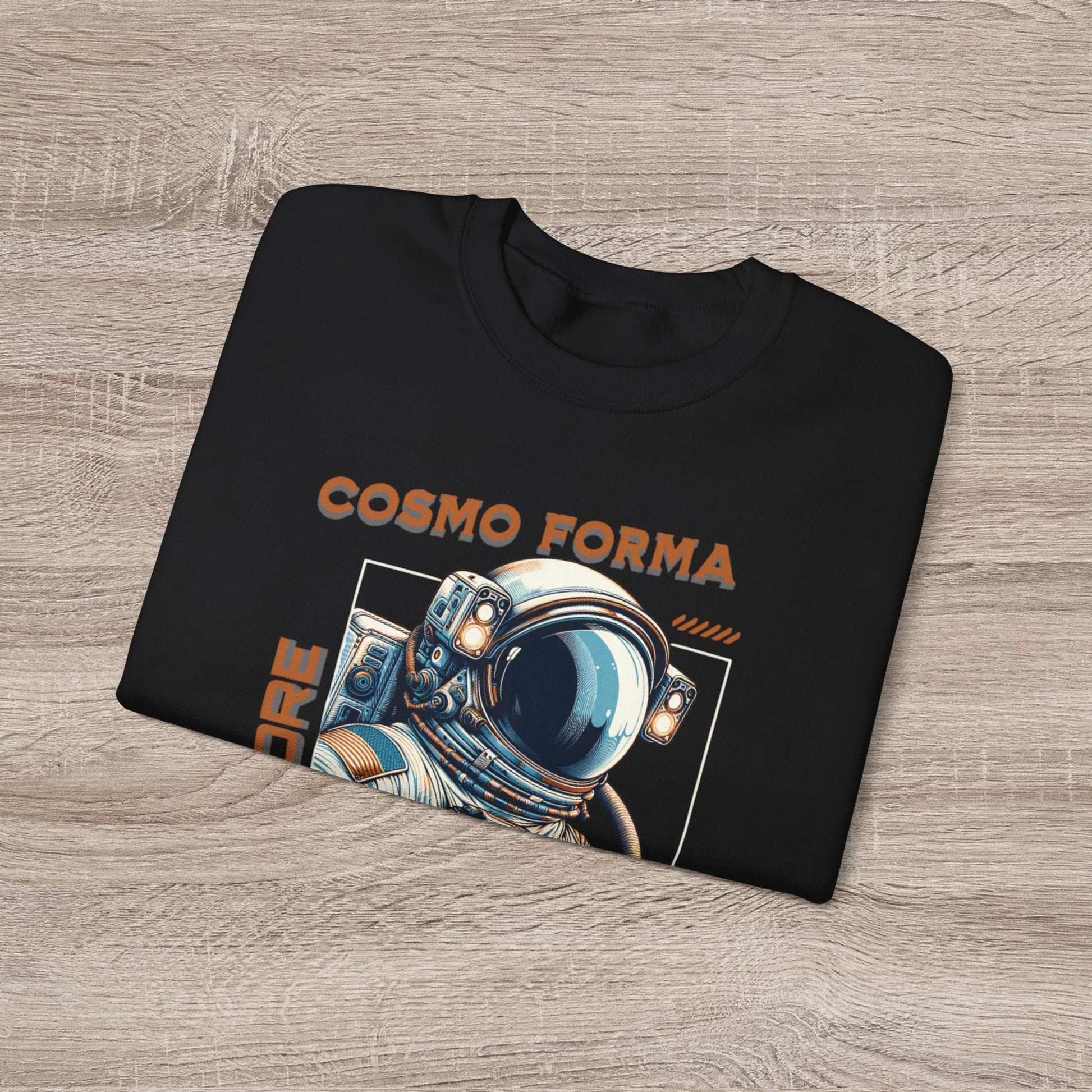 Black t-shirt with 'Cosmo Forma' design featuring an astronaut helmet on a wooden surface