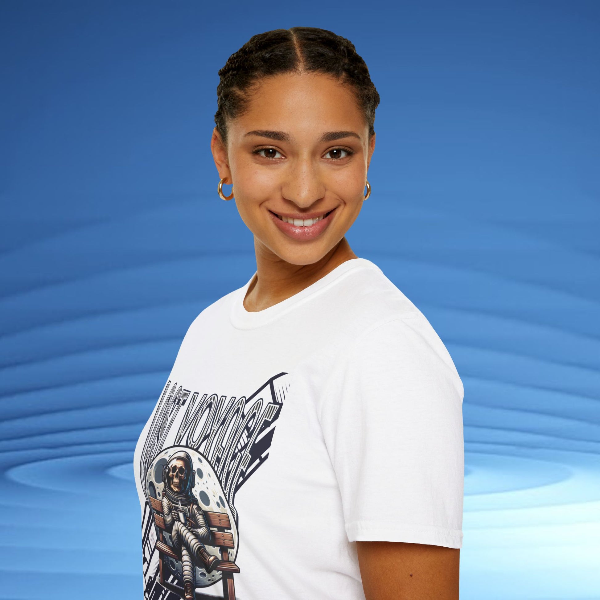 Person wearing a white t-shirt with a graphic design on a blue background