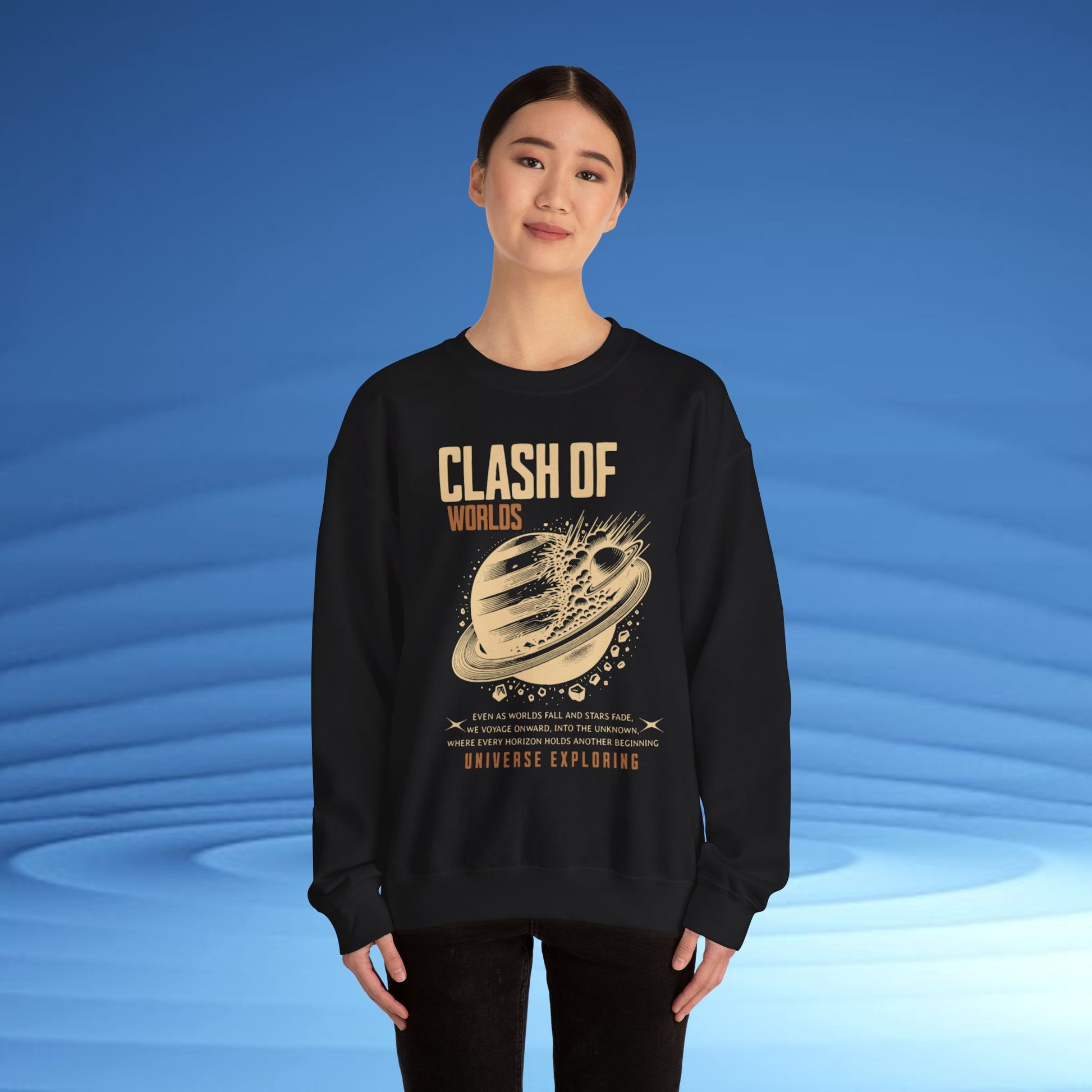 Person wearing a black sweatshirt with 'Clash of Worlds' design on a blue background