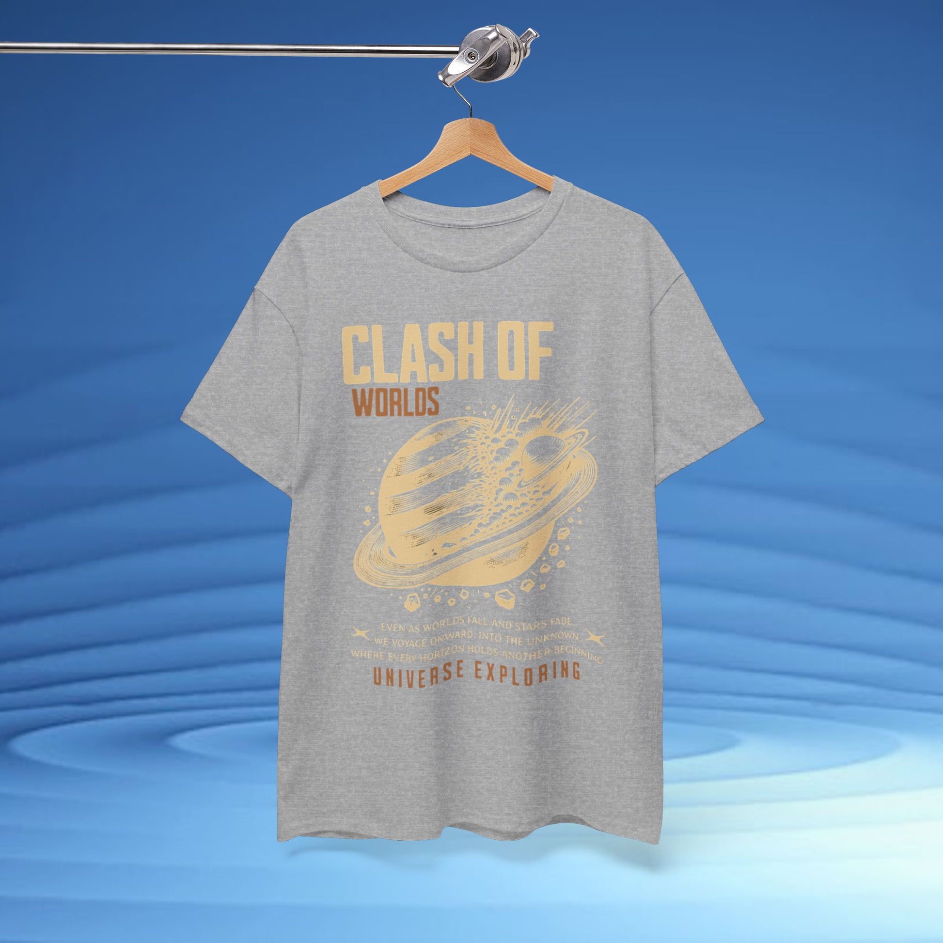 Gray t-shirt with gold graphic and text on a hanger against a blue background