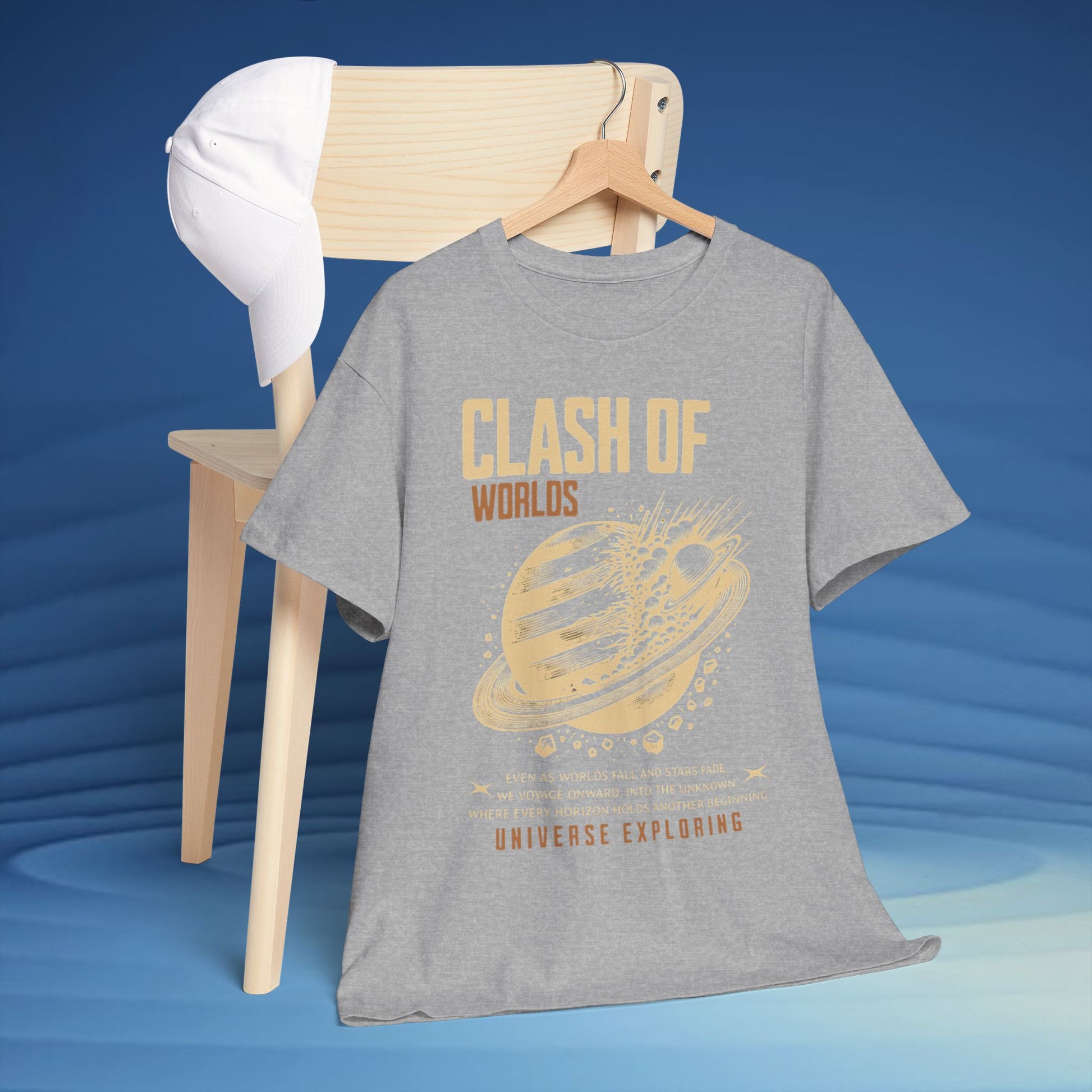 Gray t-shirt with 'Clash of Worlds' graphic design on a hanger against a blue background