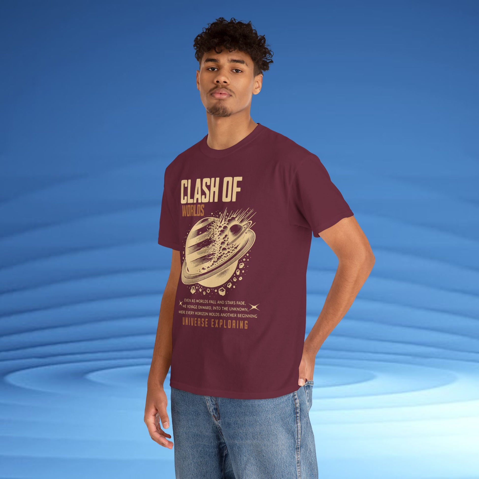 Man wearing a maroon t-shirt with 'Clash of Worlds' graphic design on a blue background