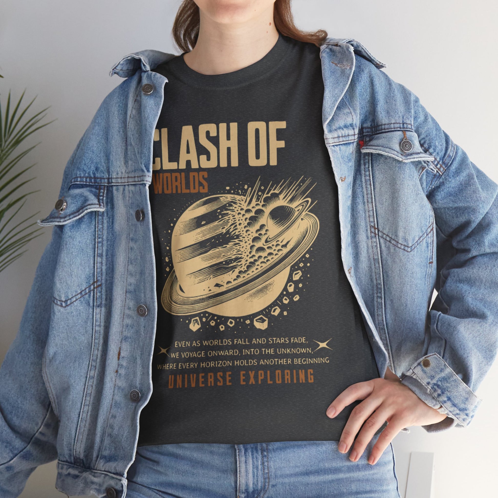 Person wearing a black t-shirt with 'Clash of Worlds' design and denim jacket.