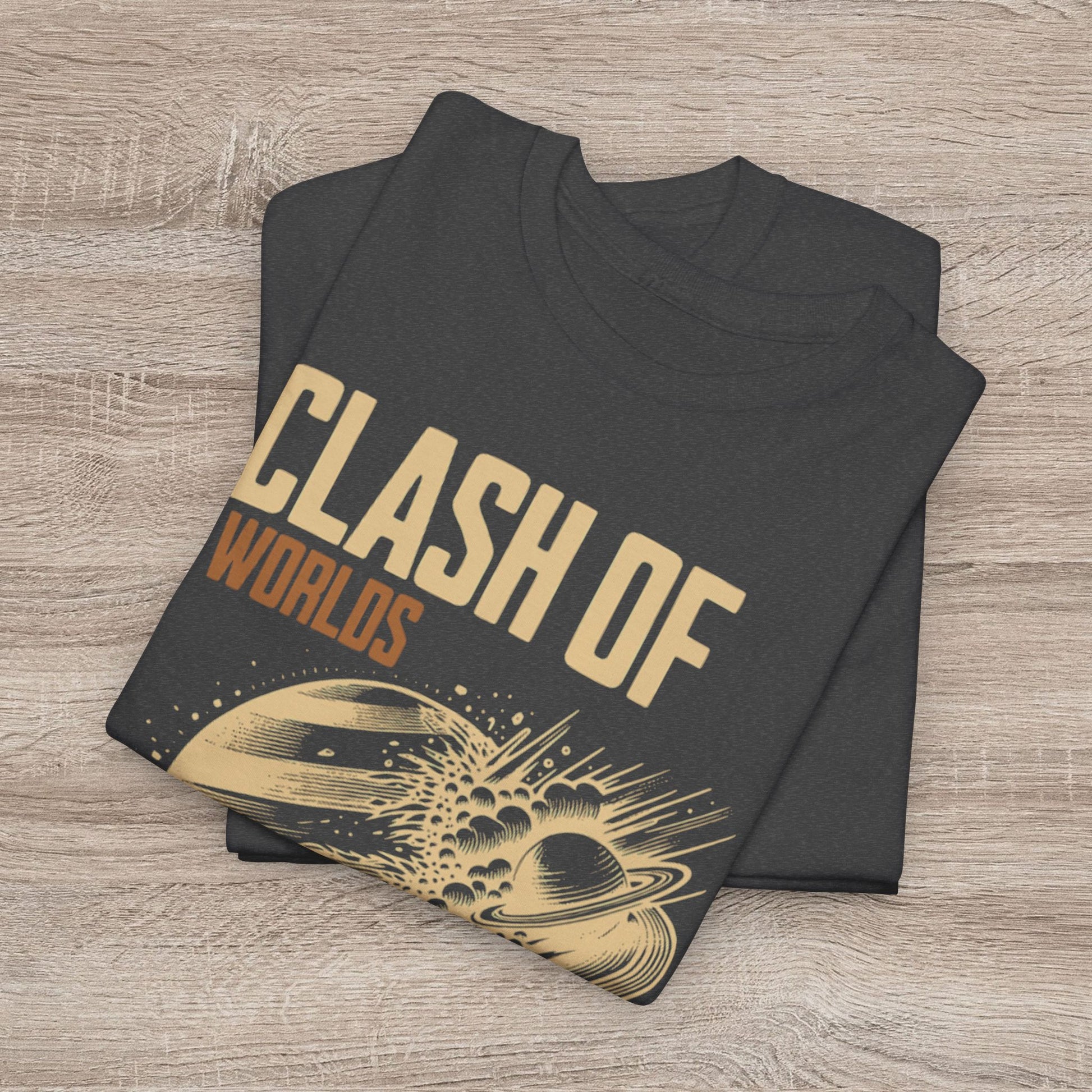 Folded black t-shirt with 'Clash of Worlds' design on a wooden surface