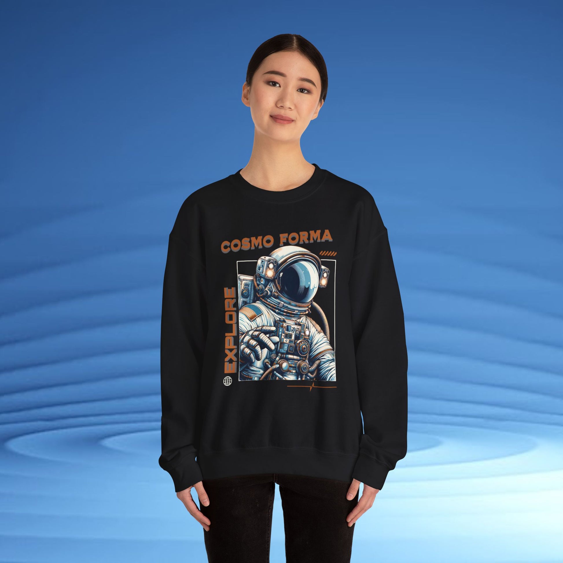 Person wearing a black sweatshirt with an astronaut graphic and 'Cosmo Forma' text on a blue background