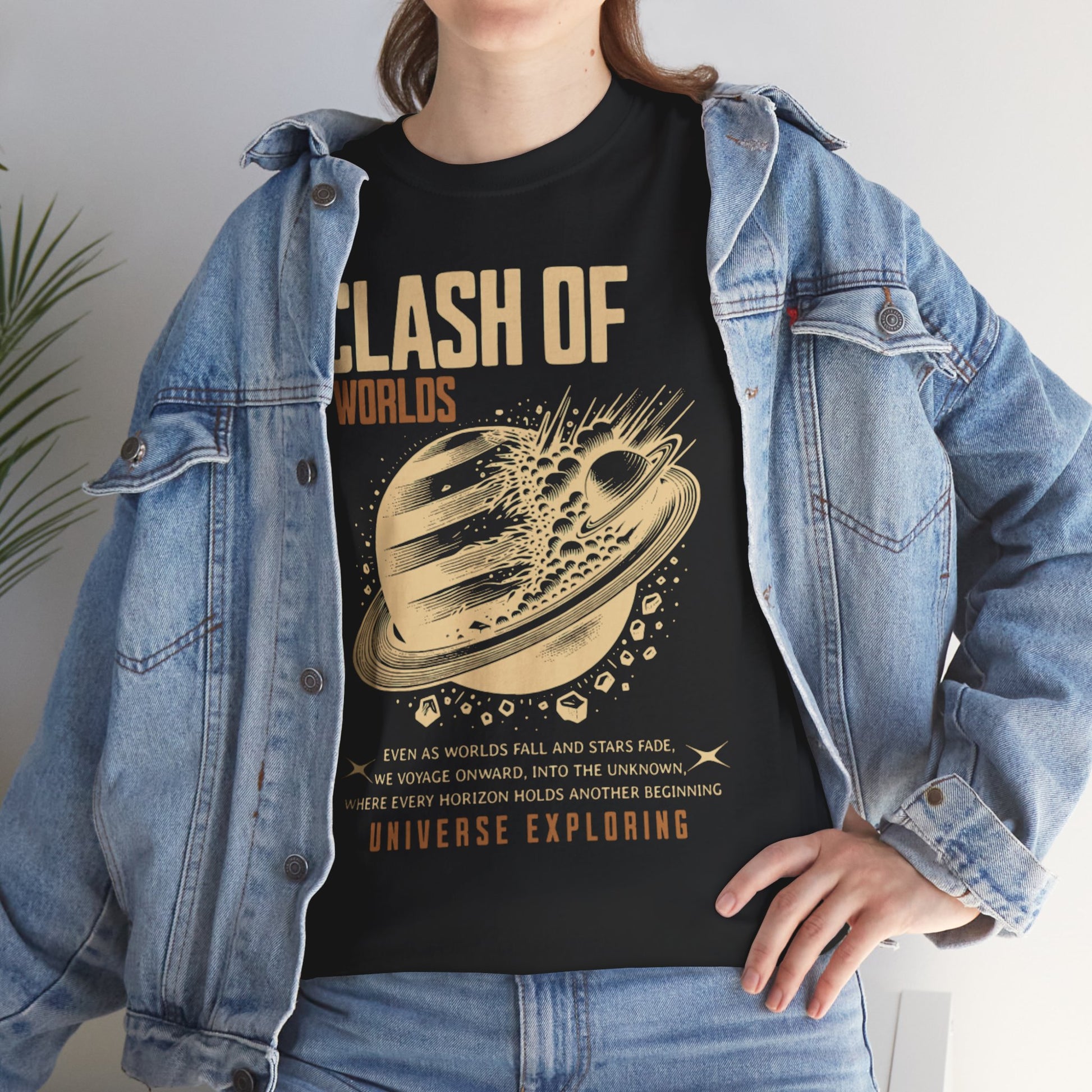 Person wearing a black t-shirt with 'Clash of Worlds' design and text, paired with a denim jacket.