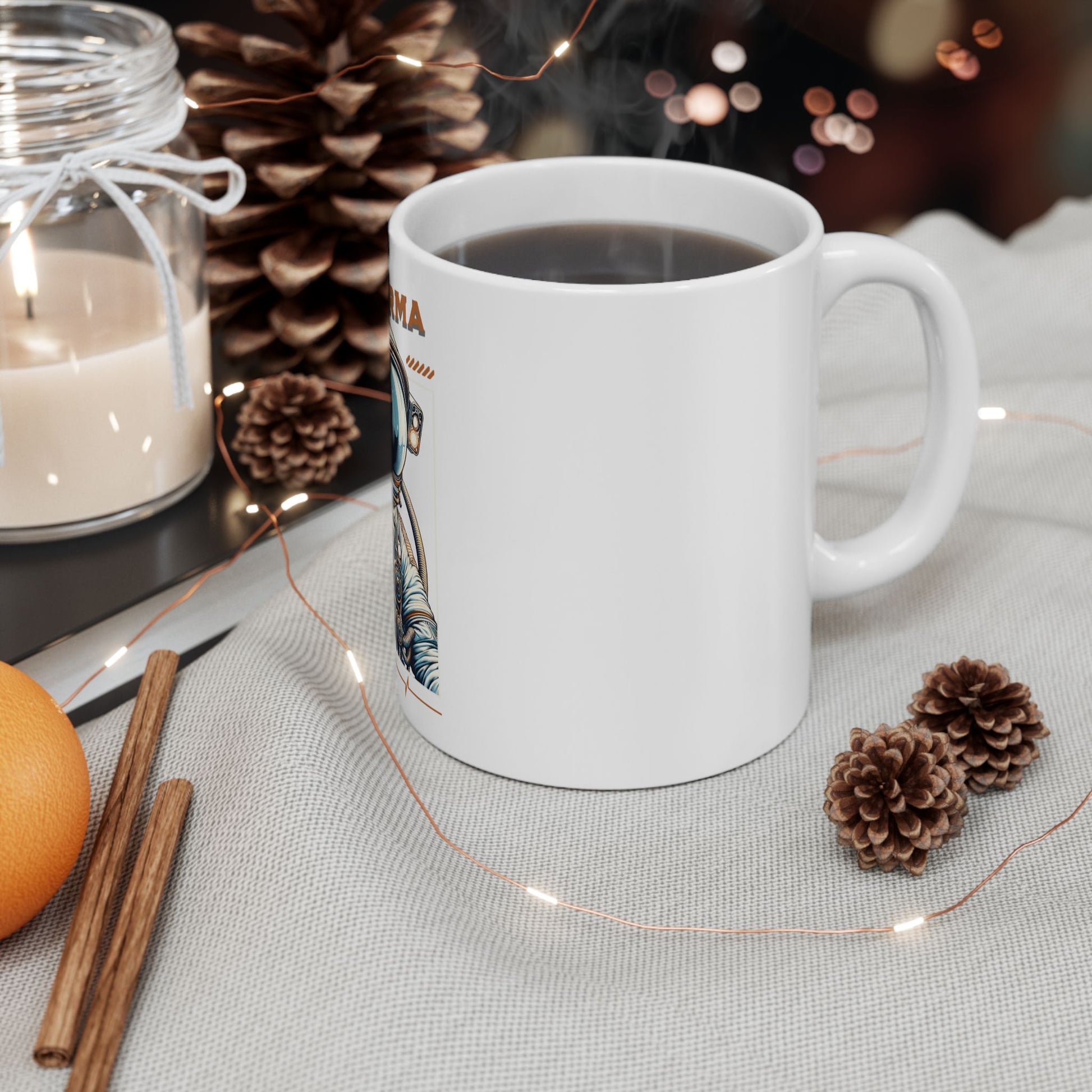 White mug with a design, surrounded by pine cones, an orange, and cinnamon sticks on a textured surface. CosmoForma