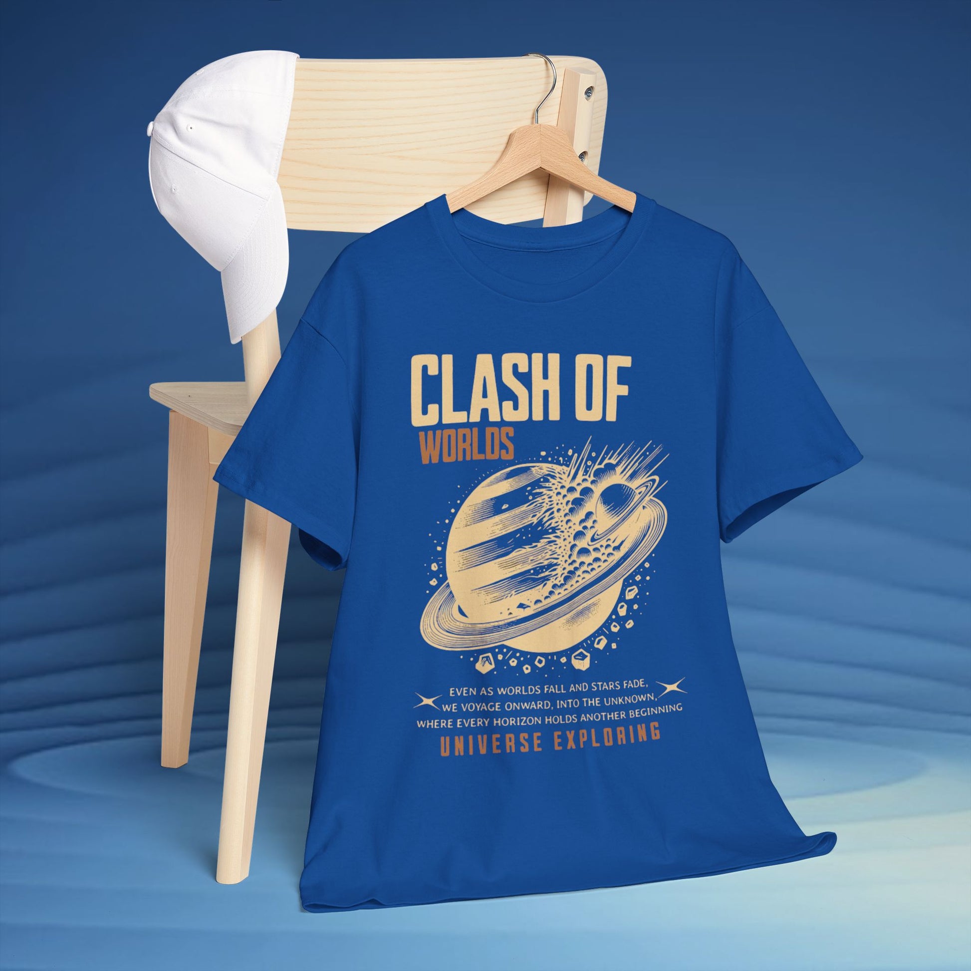 Blue t-shirt with 'Clash of Worlds' graphic design on a wooden chair against a blue background