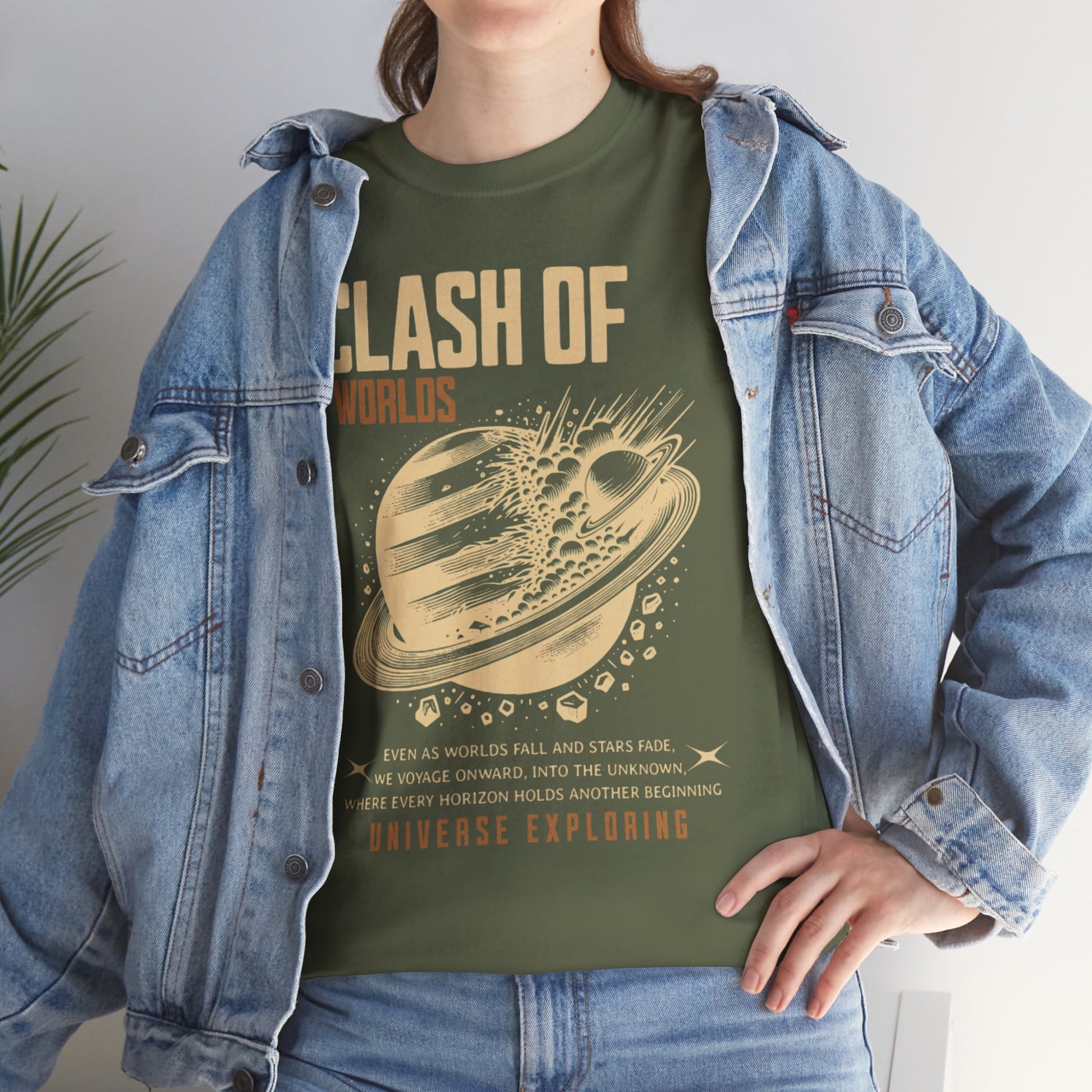 Person wearing a green t-shirt with 'Clash of Worlds' design and denim jacket.